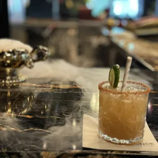 Tamarindo margarita brought out with a genie lamp with dry ice for a mystic effect
