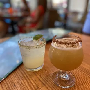 two cocktails on a table