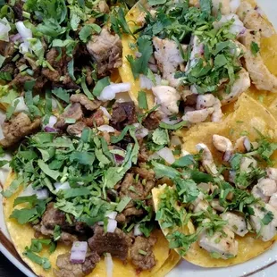 Two chicken tacos and two beef tacos