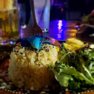 a plate of food with rice and vegetables