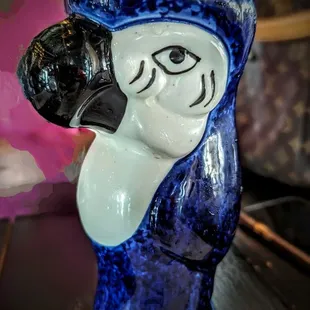 a blue bird with a yellow crown on its head