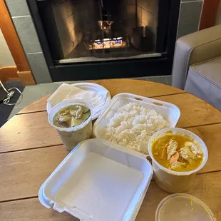 a table with food and a fire place