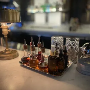 a tray of liquor bottles on a bar counter