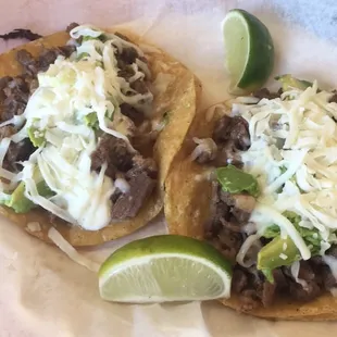 two tacos on a table