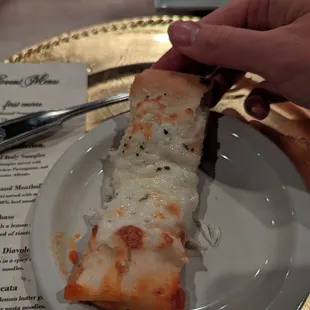 a slice of pizza on a plate