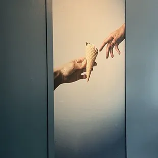 Reverse recreation of  the&quot; Creation of Adam&quot; from the Sistine Chapel of Gelato at the La Copa Loca ( crazy cup) at the Church location