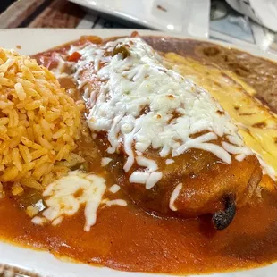 Chili relleno, cheese enchilada, rice and beans.