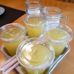 a tray of four cups of lemonade