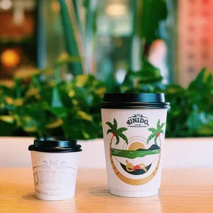 two coffee cups on a table