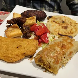 Tipico: sampler of tamale, pupusa, empanada, chicharron, fried cassava, curtido, &amp; dessert-like fried plantain w. sweet plaintain cream