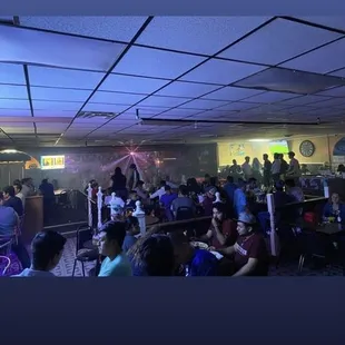 a large group of people sitting in a room
