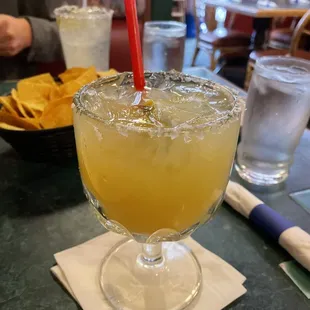 a margarita in a glass with a straw