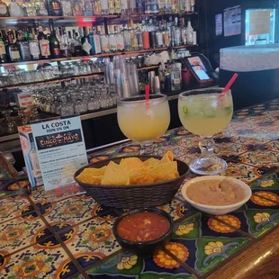 Large margaritas and complementary homemade chips and salsa with warm beans at the bar which has about 8 chairs at the rail