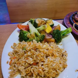 a plate of rice and vegetables