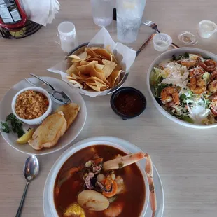 7 seas soup with Spanish rice and bread, Shrimp salad, Chips with salsa