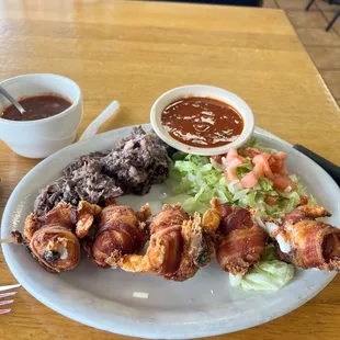 Bacon wrapped shrimp and barbacoa on the side!