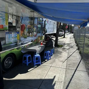 a food truck parked on the side of the road