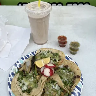 Pollo and Carne Asada tacos with a small horchata