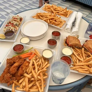 Chicken Tenders, Mahi Mahi Tacos, Side fries, Fried Chicken Club