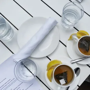 two cups of tea on a white table