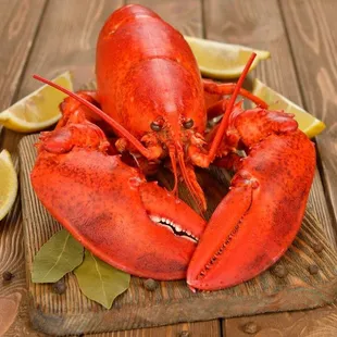 a lobster on a cutting board