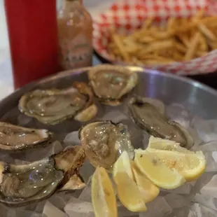 a plate of oysters and french fries