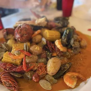 a plate of seafood and corn