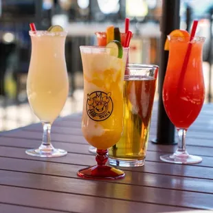 three different drinks on a table