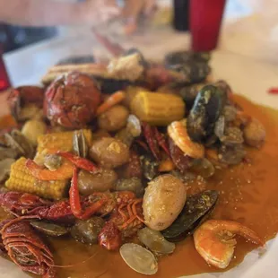 a plate of seafood and corn