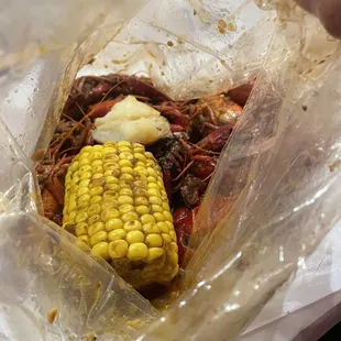 a corn on the cob in a plastic bag