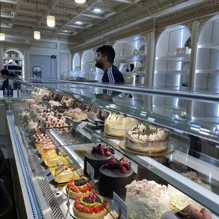 a variety of cakes on display