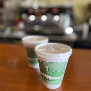 two cups of coffee on a table