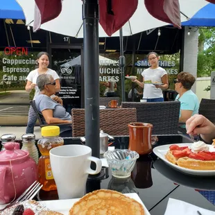 a group of people eating outside