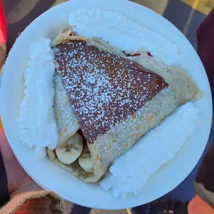 a person holding a plate of food