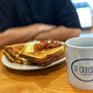 a plate of toast and a cup of coffee