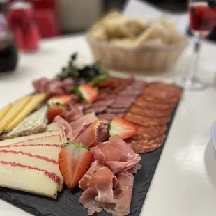 a platter of meats and cheeses