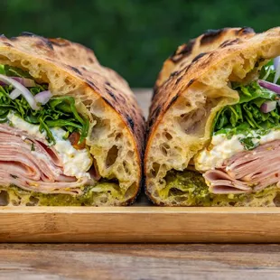 a cut in half sandwich on a cutting board