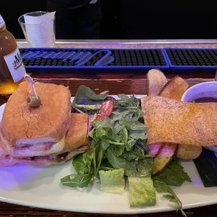Cuban sandwich with salad and bean soup.