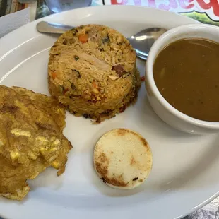 9. Arroz con Pollo with beans and Tostones