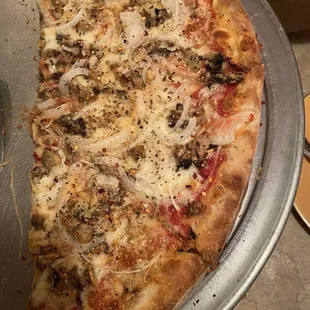 Half of our mushroom and onion pizza