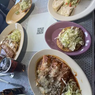 #4 tostado,  enchilada, bean burrito smothered in green or red chile- with additional burrito.