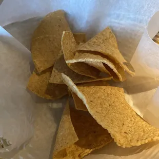 a basket of chips and a drink