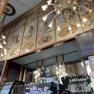 a chandelier and a bar