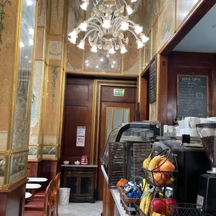 Beautiful wood and marble interior with chandeliers, mirrors and bay windows.