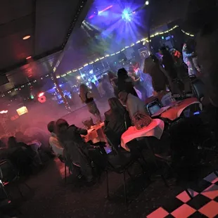 a crowd of people sitting at tables