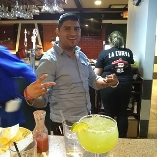 Bartender w our margarita and a smile
