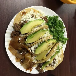 Tacos w/ fajitas, avocado, queso fresco. Tortillas are homemade and these were amazing!