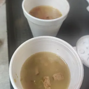 two bowls of soup on a tray