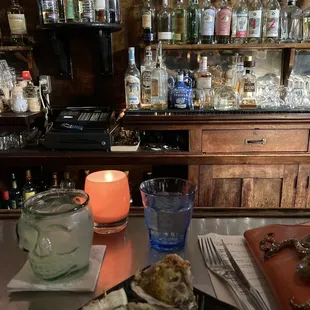 Grilled oysters and margarita at the bar