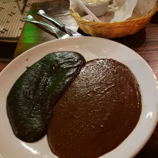 Dos moles, served with tortillas and cheese